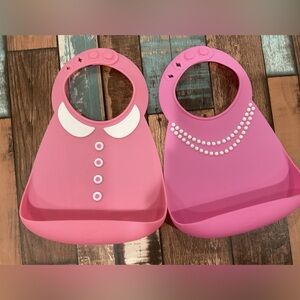 Two Abby and Finn pink bibs silicone girly